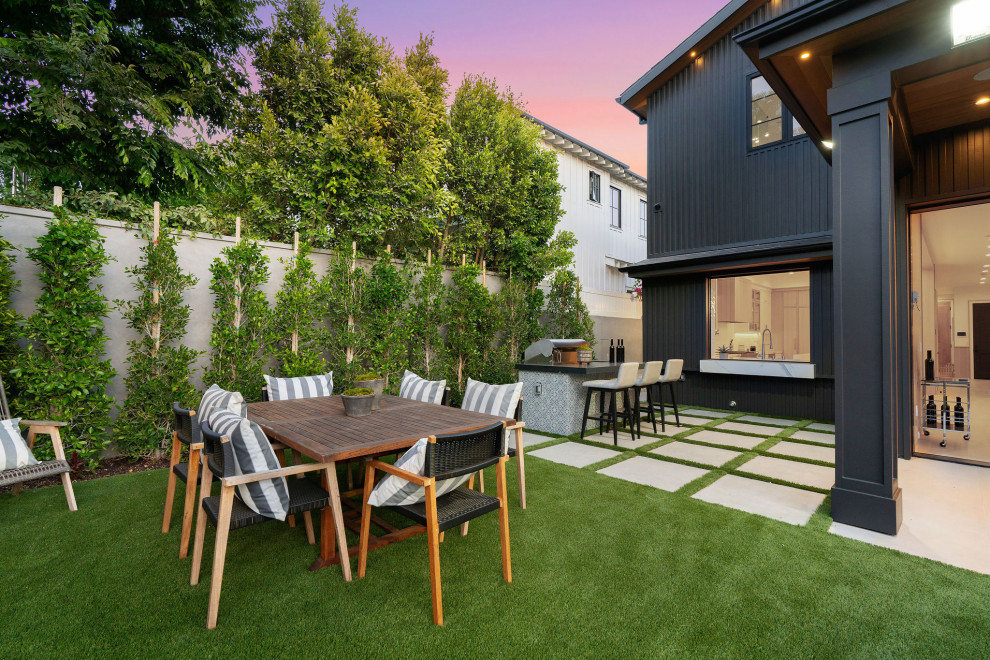 Example of a transitional backyard patio design in Los Angeles with no cover