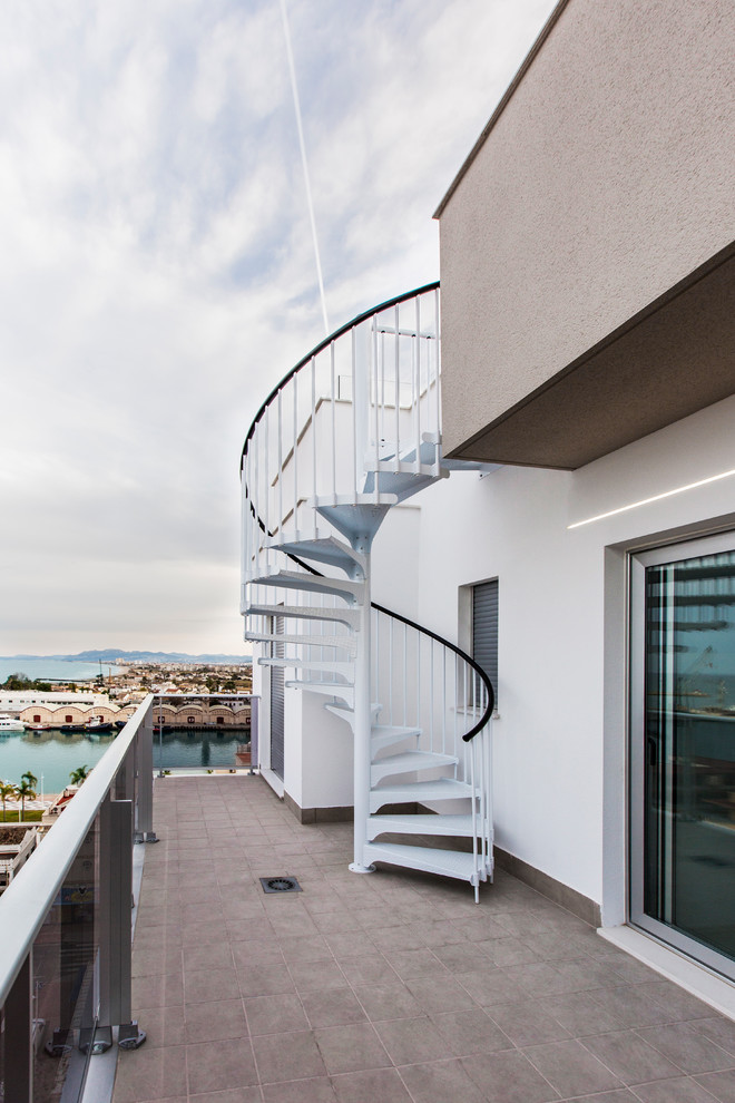 Inspiration for a beach style rooftop deck in Valencia with with dock.