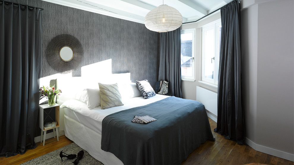 Contemporary master bedroom in Berlin with grey walls, dark hardwood floors and no fireplace.