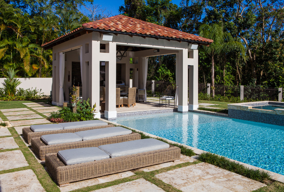Inspiration for a large transitional backyard stone and rectangular pool remodel