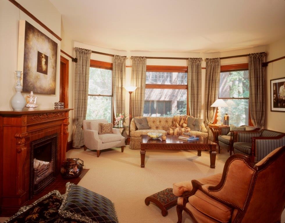 This is an example of a large traditional enclosed living room in Minneapolis with carpet.