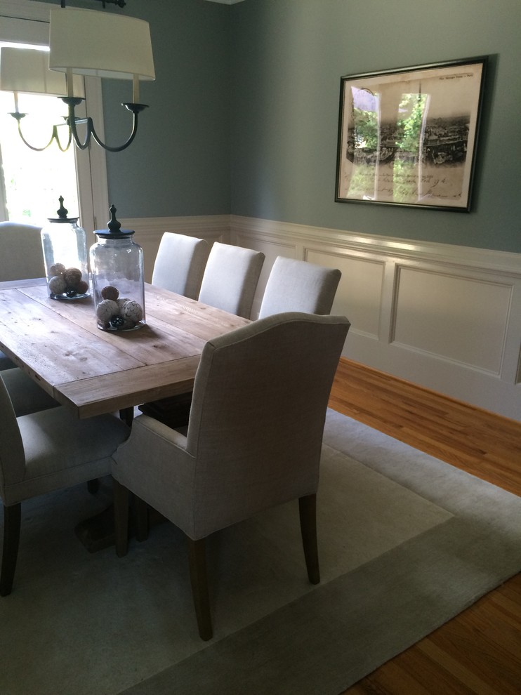 Inspiration for a mid-sized transitional light wood floor enclosed dining room remodel in Atlanta with blue walls and no fireplace