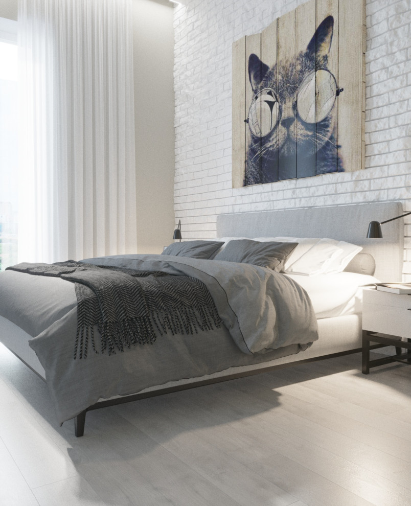 На фото: хозяйская, серо-белая спальня среднего размера в стиле лофт с белыми стенами, полом из ламината, серым полом, кирпичными стенами и акцентной стеной без камина с