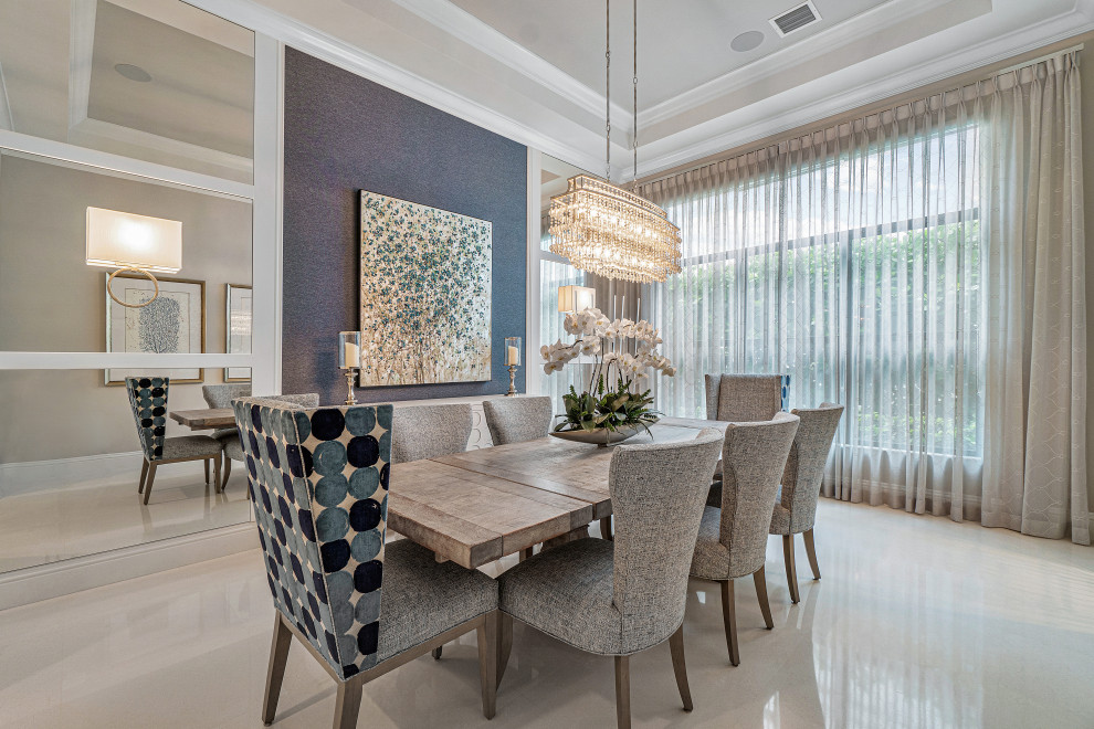 Inspiration for a large transitional open plan dining in Miami with blue walls, marble floors, beige floor and coffered.