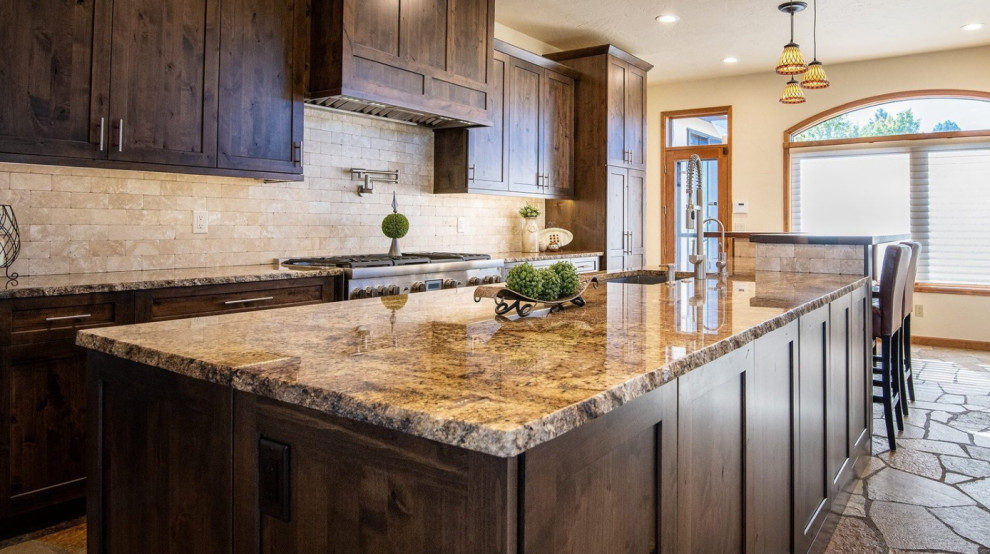 Eat-in kitchen - large single-wall cement tile floor and gray floor eat-in kitchen idea in Denver with an undermount sink, shaker cabinets, dark wood cabinets, granite countertops, beige backsplash, stone tile backsplash, stainless steel appliances, an island and beige countertops