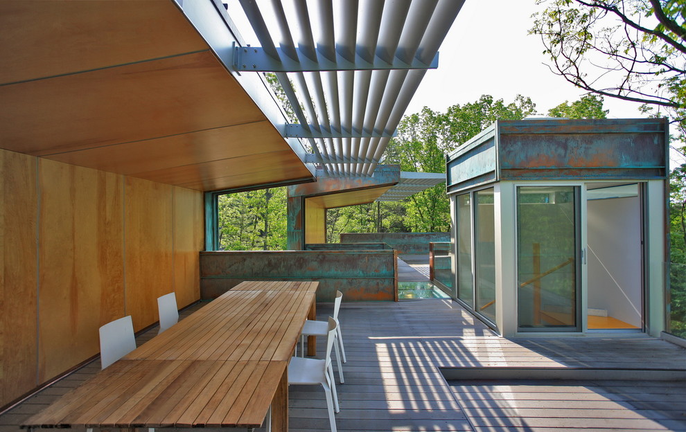 Photo of a modern deck in DC Metro with a pergola.