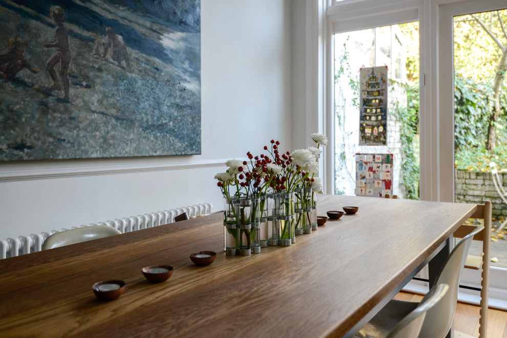 Photo of a transitional dining room in London.