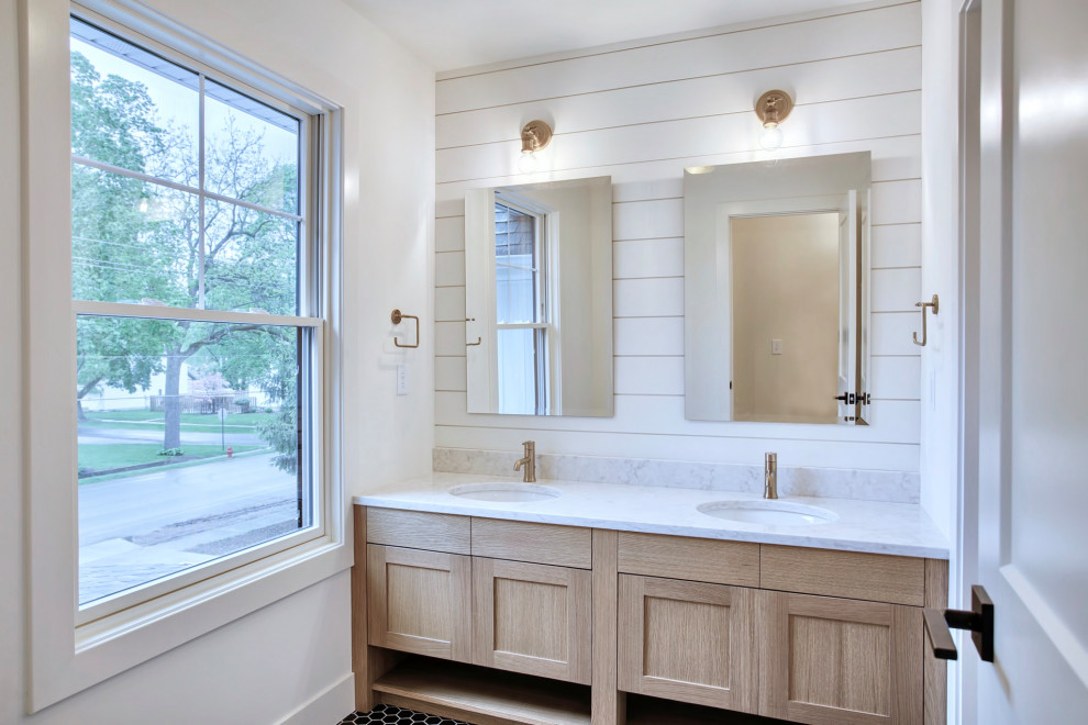Mid-sized country bathroom in Chicago with shaker cabinets, light wood cabinets, white walls, mosaic tile floors, marble benchtops, black floor, white benchtops, a double vanity, planked wall panelling and a built-in vanity.