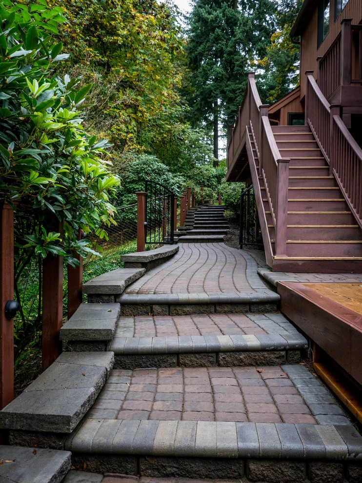 Inspiration for a large traditional sloped shaded garden in Portland with a garden path and concrete pavers.