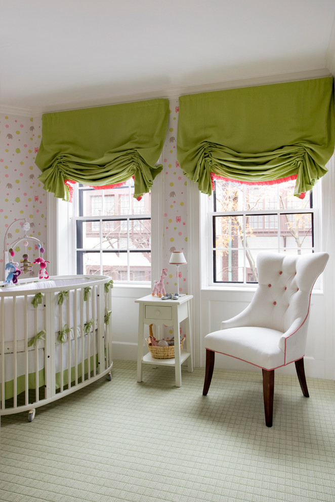 This is an example of a traditional nursery for girls in Boston with carpet and multi-coloured walls.