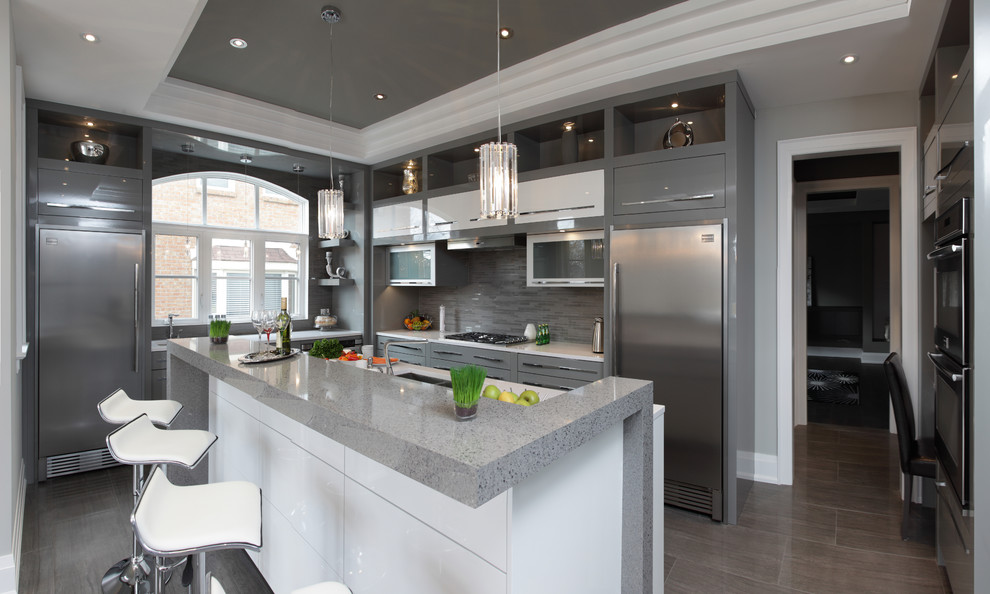 Inspiration for a large modern l-shaped separate kitchen in Toronto with a double-bowl sink, flat-panel cabinets, grey cabinets, granite benchtops, grey splashback, matchstick tile splashback, stainless steel appliances, porcelain floors and with island.