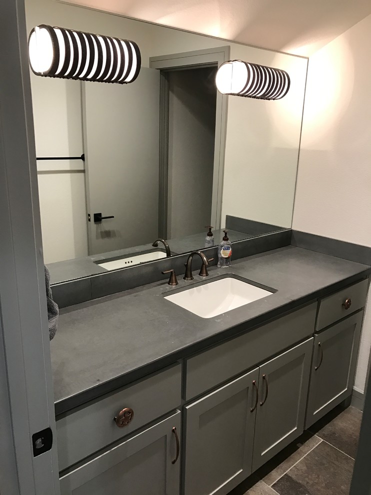 Inspiration for a mid-sized transitional 3/4 bathroom in Dallas with gray tile, porcelain tile, porcelain floors, an undermount sink, concrete benchtops, a two-piece toilet, shaker cabinets, grey cabinets, black walls and multi-coloured floor.