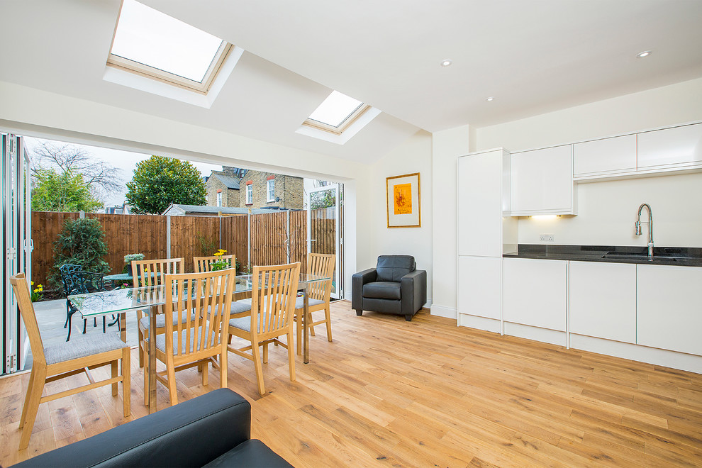 This is an example of a contemporary living room in Surrey.