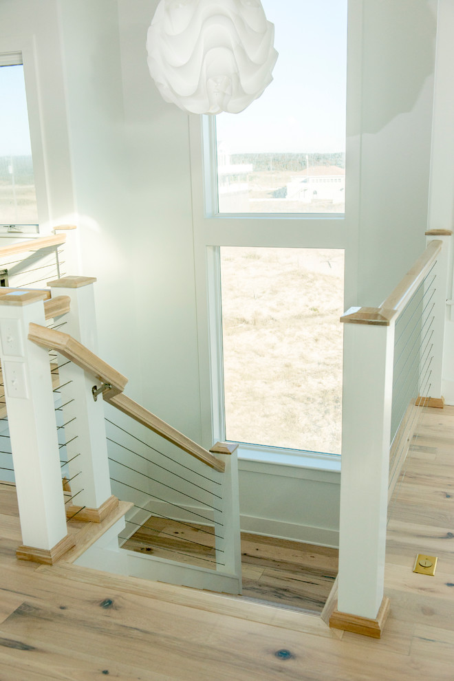 Beach style staircase in Other.