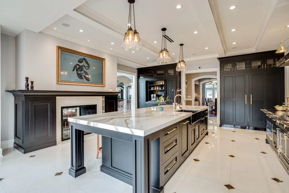 Transitional beige floor kitchen photo in Baltimore with black cabinets, beige backsplash, an island and beige countertops