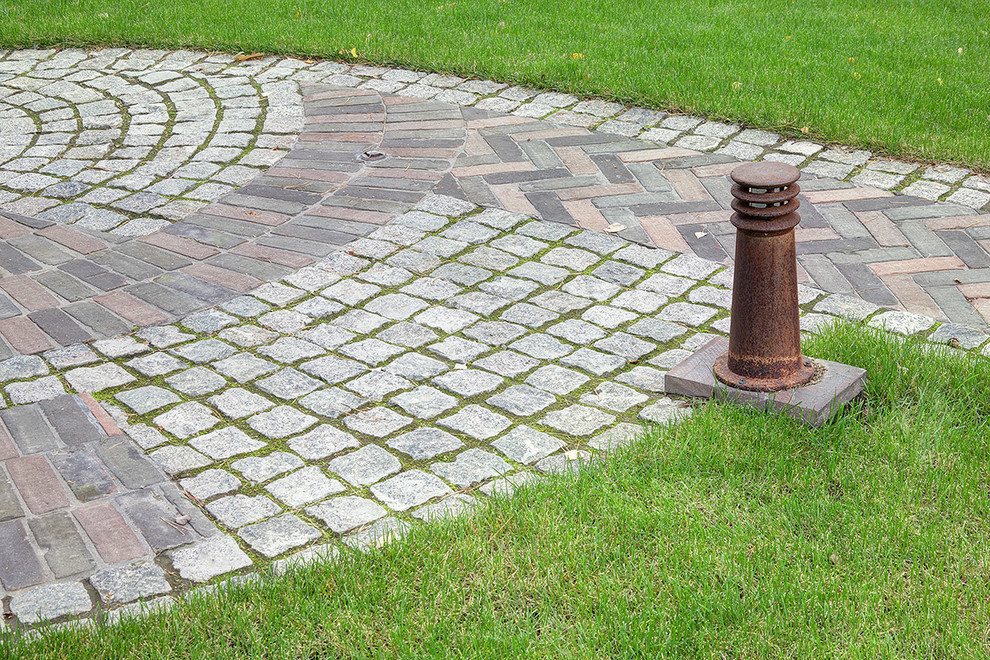 Country garden in Moscow with brick pavers.