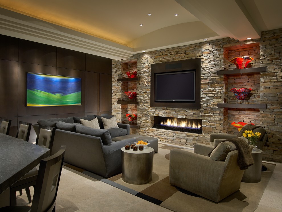 Large contemporary open concept living room in Phoenix with a ribbon fireplace, a stone fireplace surround, a wall-mounted tv, white walls and travertine floors.