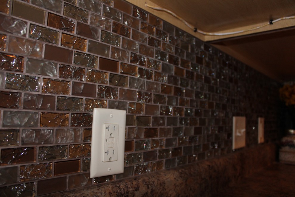 Enclosed kitchen - large transitional single-wall slate floor and beige floor enclosed kitchen idea in Cedar Rapids with shaker cabinets, dark wood cabinets, limestone countertops, beige backsplash, mosaic tile backsplash, stainless steel appliances and no island
