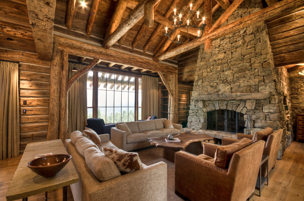Inspiration for a large traditional open concept living room in Other with medium hardwood floors, a stone fireplace surround, beige walls, a standard fireplace and a built-in media wall.