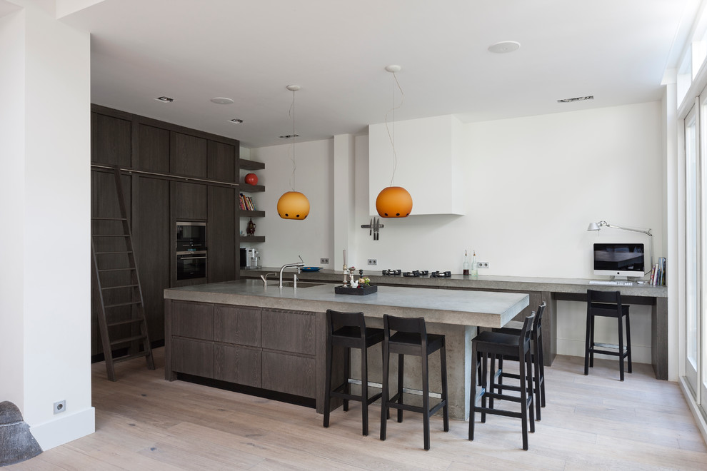 Design ideas for a contemporary kitchen in New York with concrete benchtops.