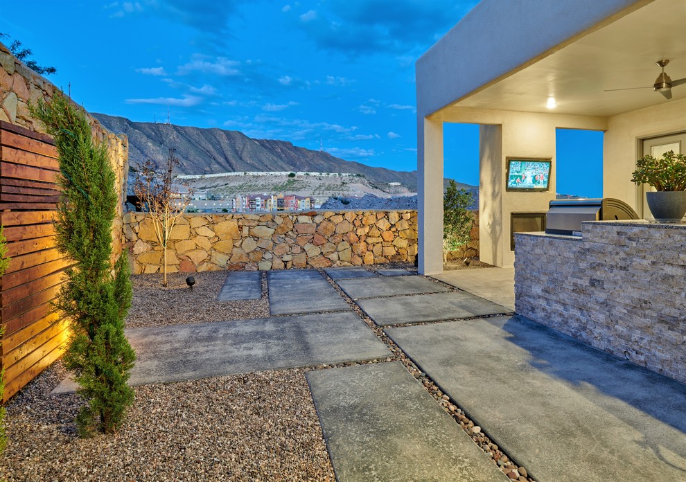 Photo of a small drought-tolerant backyard concrete paver garden path.
