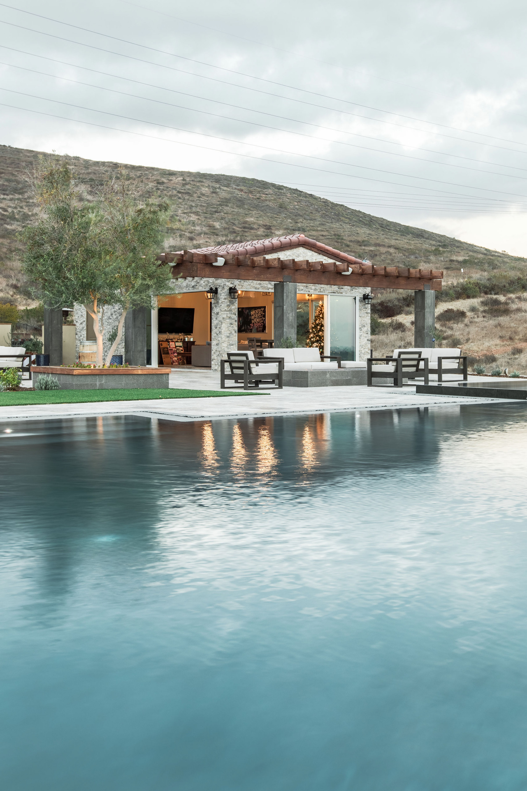 Gorgeous Infinity Pool with mulitple outdoor living spaces