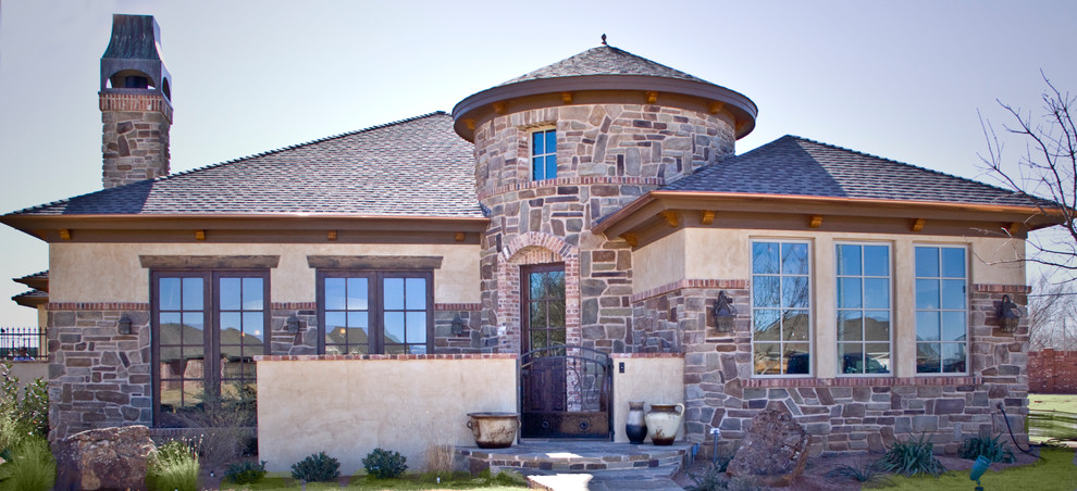 This is an example of a country one-storey exterior in Austin with stone veneer.
