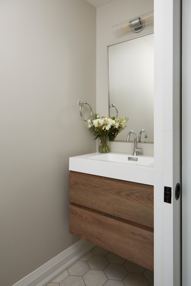 Inspiration for a small transitional mosaic tile floor and brown floor powder room remodel in Toronto with raised-panel cabinets, dark wood cabinets, quartzite countertops, white countertops and a floating vanity