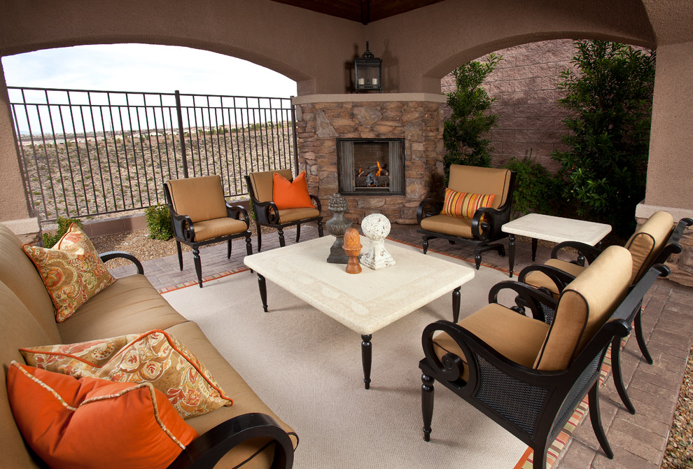 Design ideas for a traditional patio in Las Vegas with brick pavers and a fire feature.