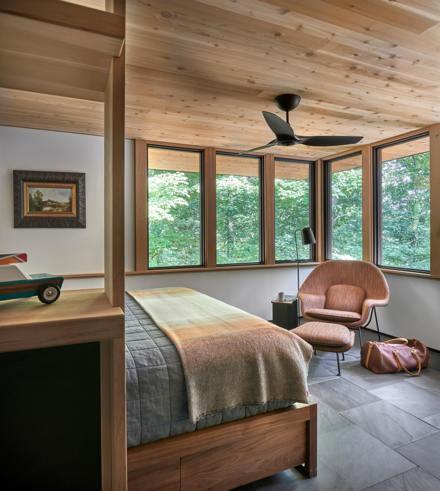 Lawless Retreat - The cedar ceiling extends unimpeded out to the roof overhang while the corner windows expand the scale of the room well beyond its modest footprint.