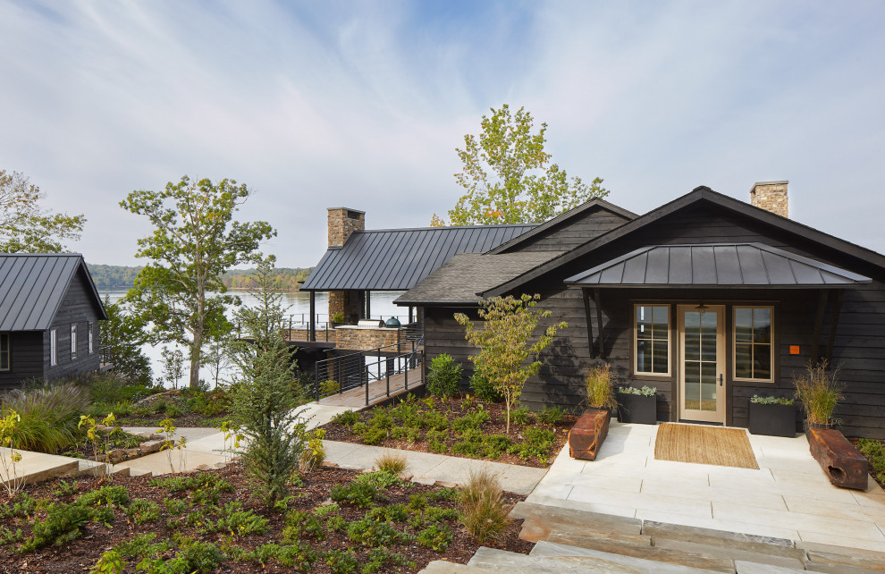 Design ideas for an expansive country two-storey blue house exterior in Nashville with a mixed roof, wood siding, a gambrel roof, a grey roof and clapboard siding.
