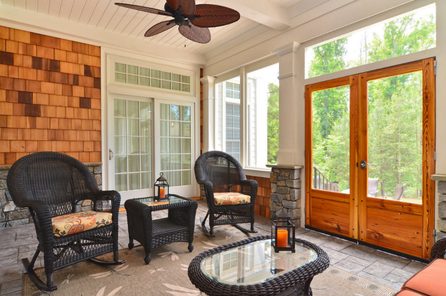 Inspiration for a backyard balcony deck remodel with a roof extension
