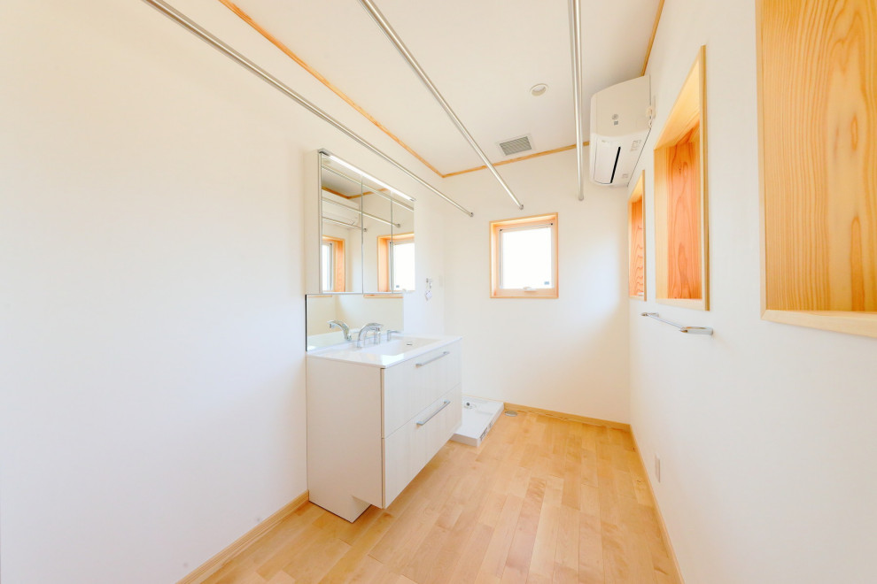 Traditional dedicated laundry room in Other.