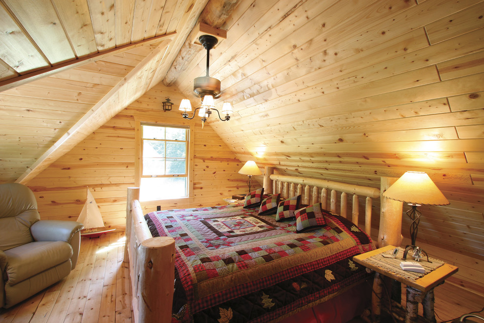 Inspiration for a mid-sized rustic guest light wood floor and beige floor bedroom remodel with beige walls and no fireplace
