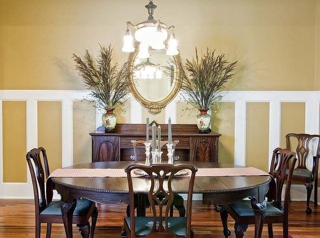 This is an example of a traditional dining room in Miami with medium hardwood floors.