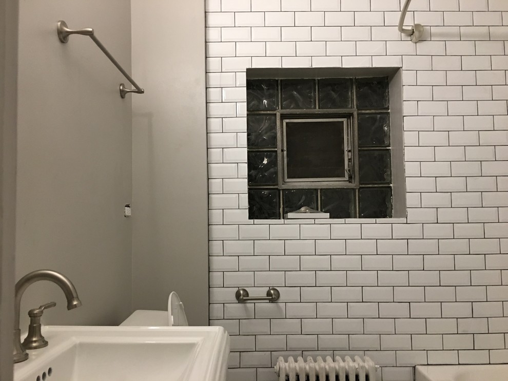 Inspiration for a mid-sized transitional 3/4 gray tile, white tile and subway tile bathroom remodel in Chicago with a one-piece toilet, white walls and a pedestal sink