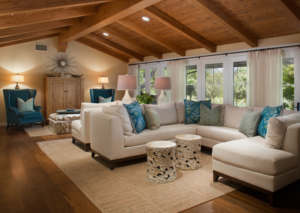 Photo of a large traditional formal enclosed living room in San Diego with beige walls and medium hardwood floors.