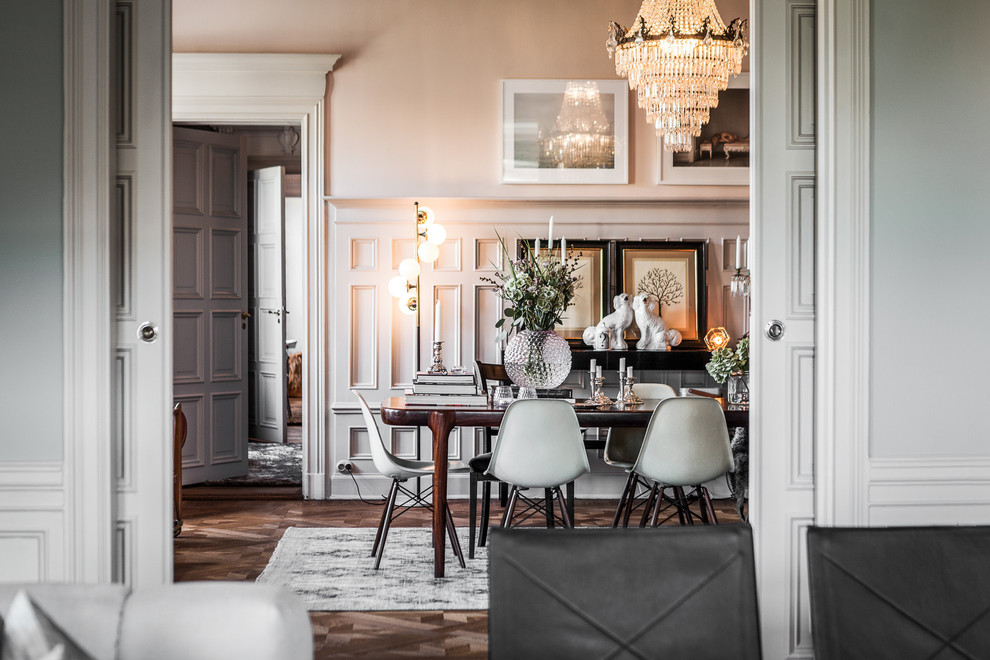 Inspiration for a large scandinavian dining room in Stockholm with white walls, dark hardwood floors and no fireplace.