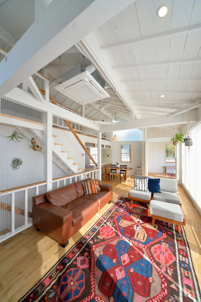 Inspiration for a beach style sunroom in Other with light hardwood floors and beige floor.