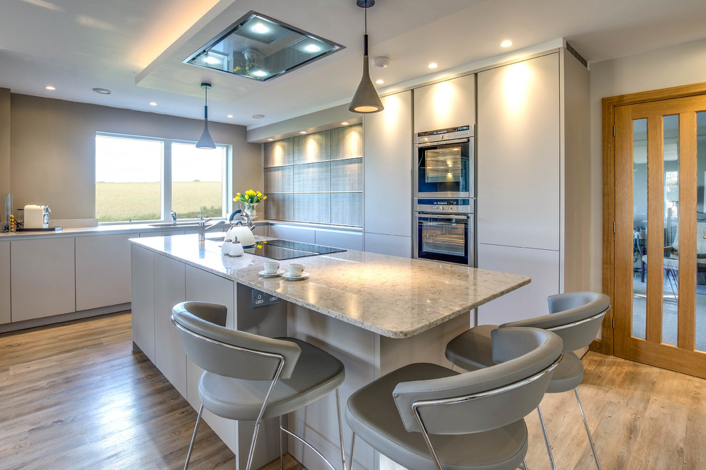 This is an example of a large contemporary kitchen in Gloucestershire.