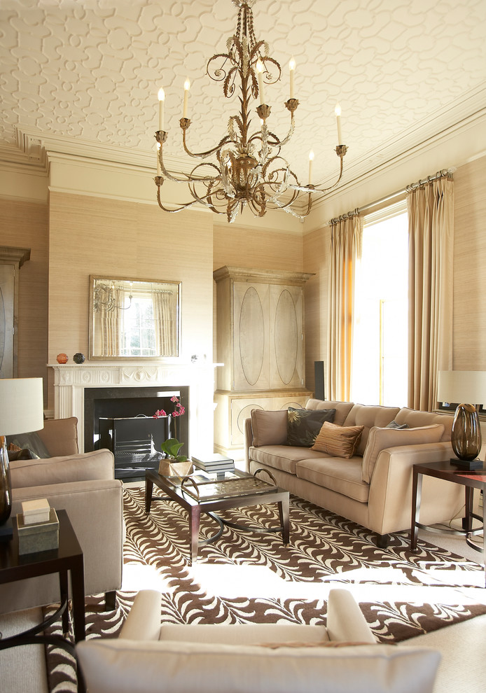 Inspiration for a transitional formal living room in West Midlands with beige walls, a standard fireplace and no tv.