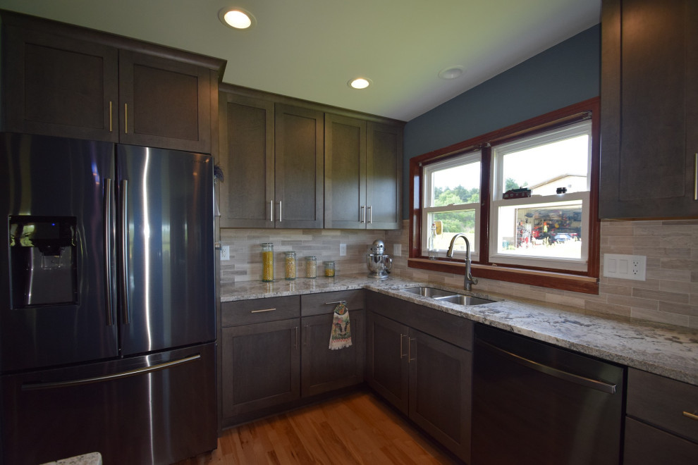Eat-in kitchen - transitional l-shaped light wood floor eat-in kitchen idea with an undermount sink, shaker cabinets, gray cabinets, granite countertops, multicolored backsplash, stone tile backsplash, stainless steel appliances, an island and multicolored countertops