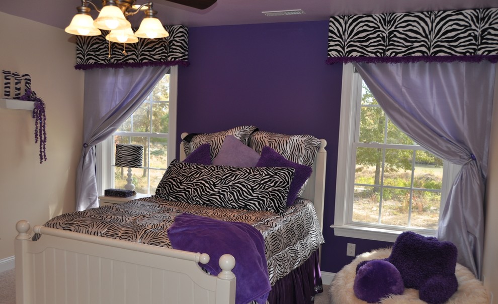Photo of a large transitional bedroom in Raleigh with purple walls, carpet, no fireplace and beige floor.