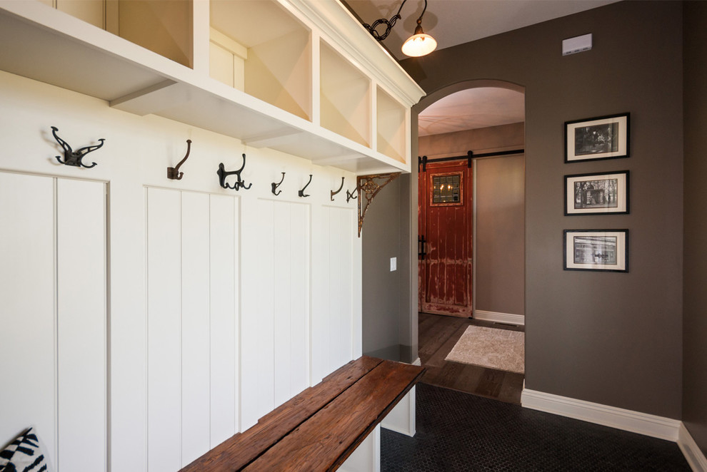 This is an example of a country entryway in Cleveland with grey walls, a double front door and a medium wood front door.