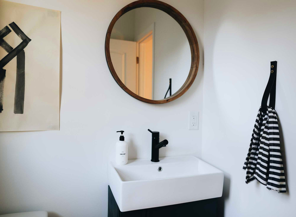 Bathroom - small 1960s 3/4 cement tile floor, gray floor and single-sink bathroom idea in Other with green cabinets, a one-piece toilet, white walls, a wall-mount sink and a floating vanity