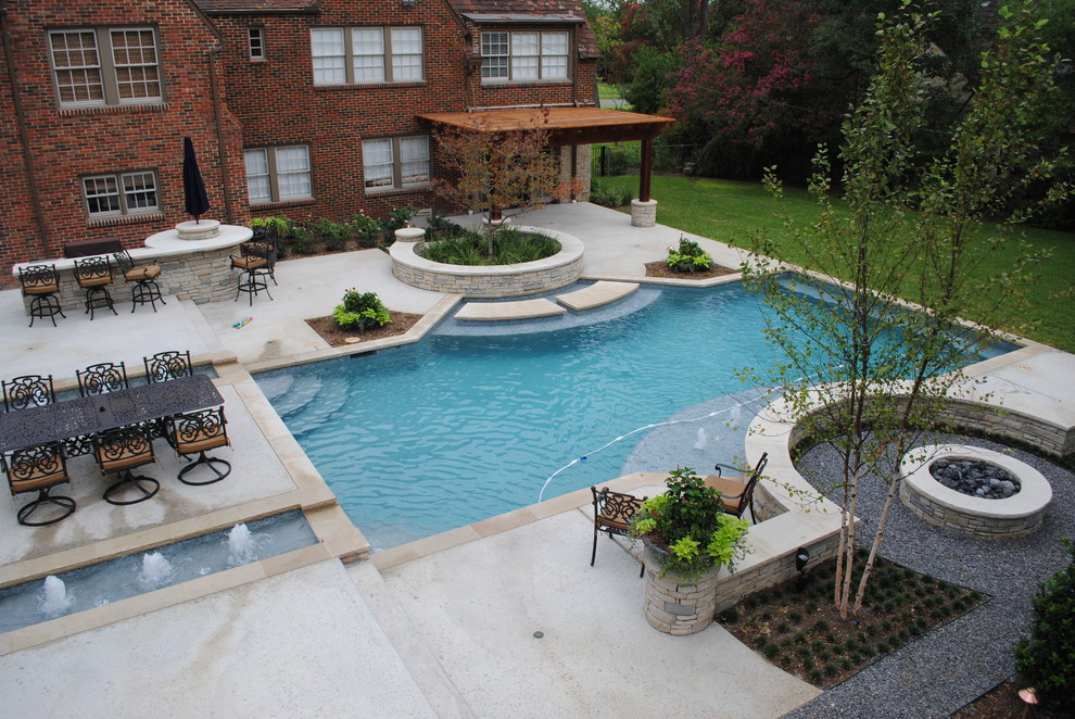 Photo of a traditional backyard pool in Dallas.