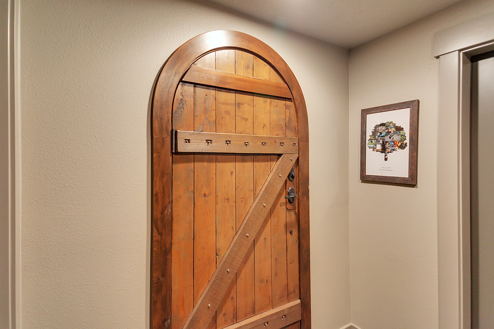 Mid-sized country front door in Portland with beige walls, a single front door and a medium wood front door.
