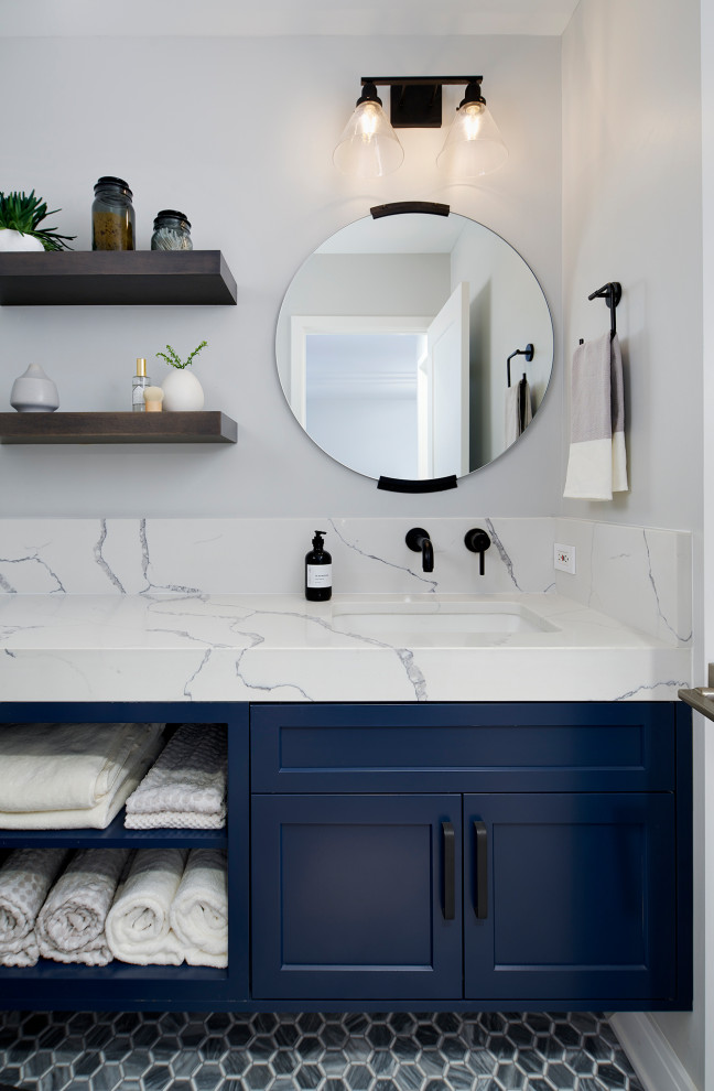 This is an example of a small transitional bathroom in Chicago with blue cabinets, white walls, multi-coloured floor, white benchtops, shaker cabinets, marble floors, engineered quartz benchtops, a single vanity and a floating vanity.
