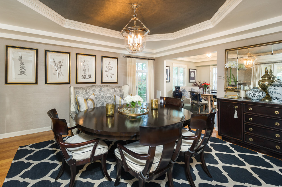 Traditional dining room in Los Angeles with grey walls and medium hardwood floors.