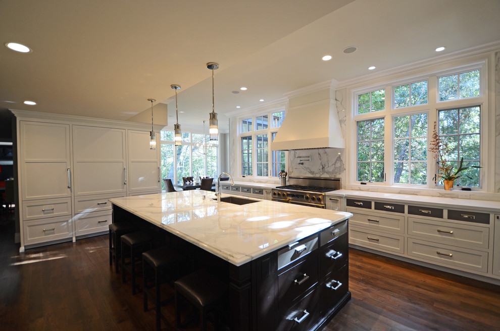 Traditional kitchen in San Francisco with recessed-panel cabinets, white cabinets, marble benchtops, white splashback and stone slab splashback.